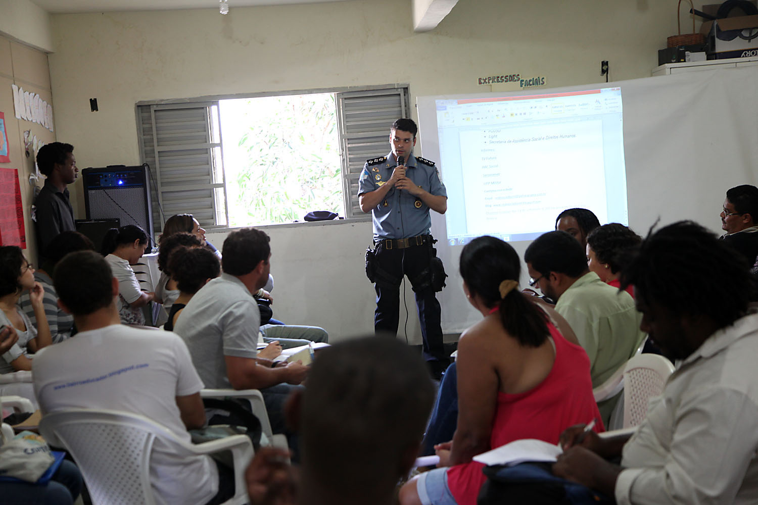 Captain Bruno Amaral de Margalhaes, commanding officer of the Borel UPP, speaks with residents at a community meeting.