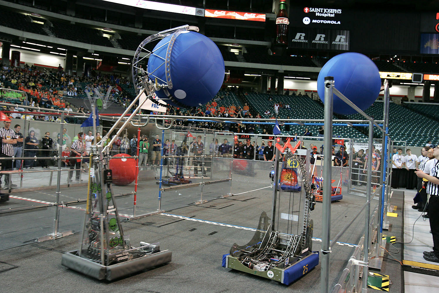 Robots scored points by maneuvering spheres around a track and over obstacles.